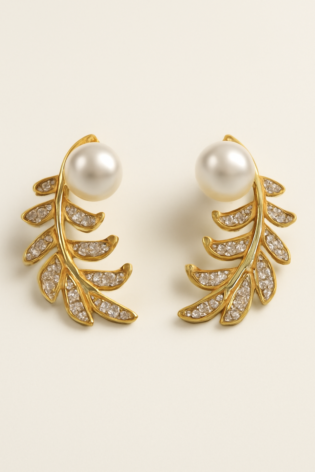 Elegant Gold Leaf Pearl Earrings with Crystal Detailing